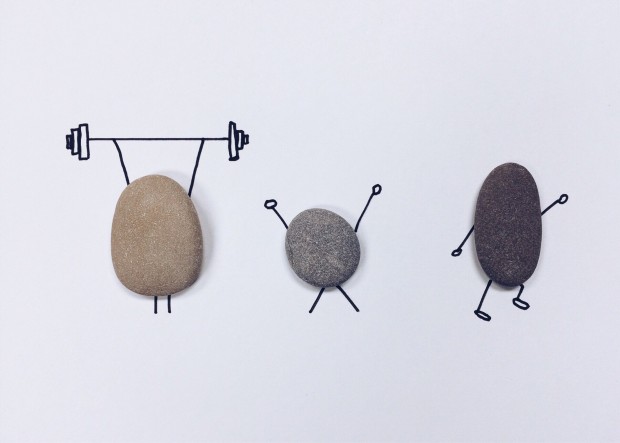 pebbles with line art around them